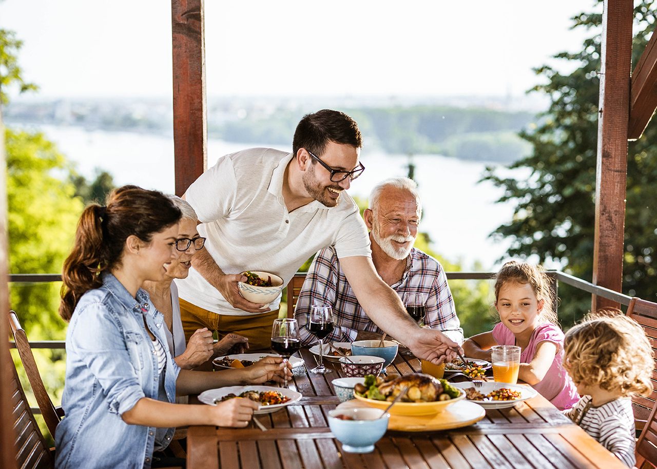 Three generations having family dinner together